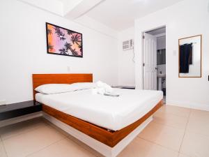 Voodi või voodid majutusasutuse CJS Boracay Joint toas