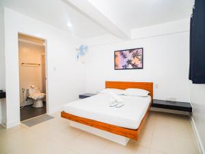 Voodi või voodid majutusasutuse CJS Boracay Joint toas