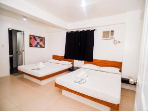 Voodi või voodid majutusasutuse CJS Boracay Joint toas