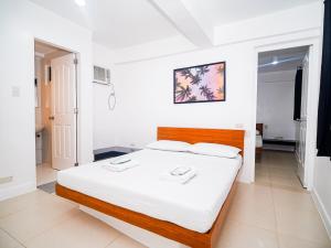 Voodi või voodid majutusasutuse CJS Boracay Joint toas