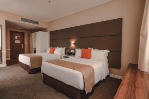 Krevet ili kreveti u jedinici u objektu Paseo La Galería Hotel & Suites