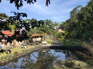 Вид на бассейн в Pousada Recanto do Zeca casa 3 или окрестностях