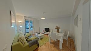 a living room with a couch and a table at Casa Angela in Santoña