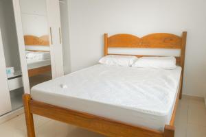 מיטה או מיטות בחדר ב-Residencial Sales