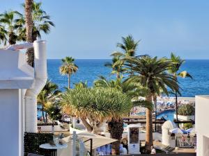 a view of the ocean from the balcony of a resort at Attic 10 by Grupo Compostelana in Puerto de la Cruz