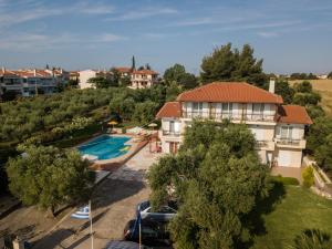 an aerial view of a house with a swimming pool at Aphrodite Studios in Kallithea Halkidikis