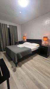 Postel nebo postele na pokoji v ubytování Hotel Capada