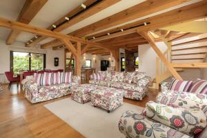 a living room with couches and a table at mussurhouse in Ustka