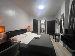 Postel nebo postele na pokoji v ubytování Hotel Capada