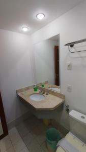 a bathroom with a sink and a mirror at M-Flat II Hotel - Vila Olimpia in Sao Paulo