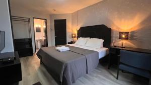 Postel nebo postele na pokoji v ubytování Hotel Capada
