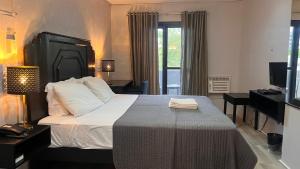 Postel nebo postele na pokoji v ubytování Hotel Capada