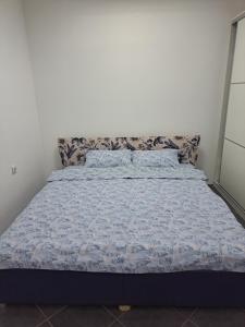 Una cama o camas en una habitación de Apartman Dimitrijevic