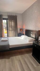 Postel nebo postele na pokoji v ubytování Hotel Capada