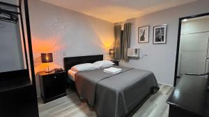 Postel nebo postele na pokoji v ubytování Hotel Capada