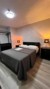 Postel nebo postele na pokoji v ubytování Hotel Capada