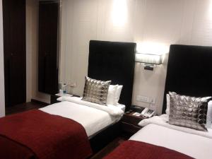 Voodi või voodid majutusasutuse The Nanee Suites toas