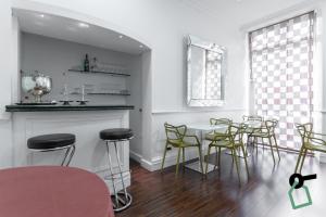 a dining room with a table and chairs at HOTIDAY Hotel Roma Porta Pia in Rome