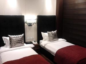 Voodi või voodid majutusasutuse The Nanee Suites toas