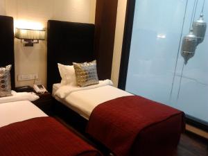 Voodi või voodid majutusasutuse The Nanee Suites toas