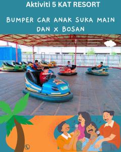 a family riding on a roller coaster at an amusement park at BY LG Resort & Water Park Melaka in Melaka