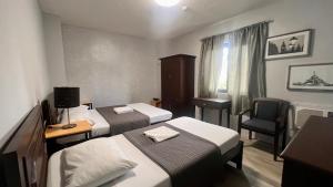 Postel nebo postele na pokoji v ubytování Hotel Capada