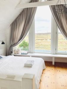 Łóżko lub łóżka w pokoju w obiekcie Apartamenty Pogodna
