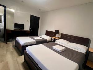 Postel nebo postele na pokoji v ubytování Hotel Capada