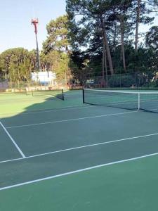two tennis nets on a tennis court at Alquiler Apto Punta Del Este in Punta del Este