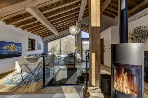 a fireplace in the living room of a home at Chalet Silver Forest in Chamonix-Mont-Blanc