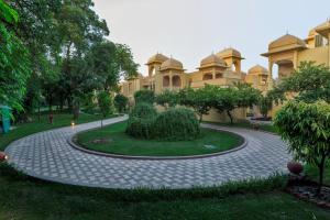 a walkway in front of a building at Heritage Village Resort & Spa Manesar-Gurgaon in Gurgaon