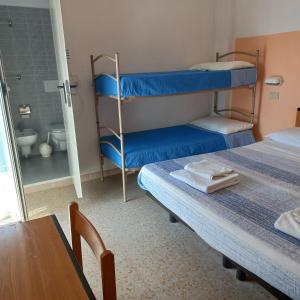 Postel nebo postele na pokoji v ubytování Hotel Bing