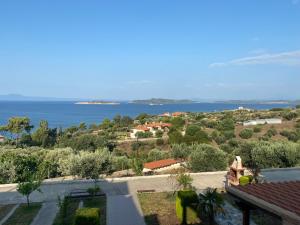 a view of the ocean from a house at Panorama Drenia in Ouranoupoli