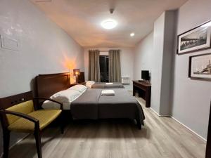 Postel nebo postele na pokoji v ubytování Hotel Capada