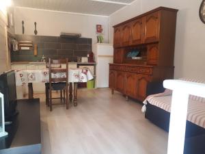 a kitchen with a sink and a table with chairs at Gîte les romarins in Le Thoronet