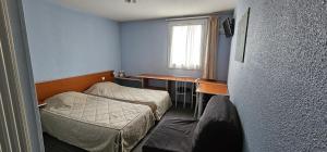 Katil atau katil-katil dalam bilik di Hotel Lyon Sud, Pierre Benite, St Genis Laval