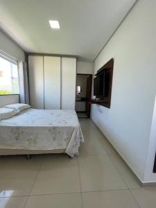 Ένα ή περισσότερα κρεβάτια σε δωμάτιο στο Casa Paripueira Maceió Alagoas Condomínio Acquaville D11