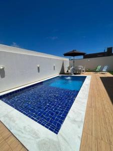 Πισίνα στο ή κοντά στο Casa Paripueira Maceió Alagoas Condomínio Acquaville D11
