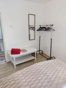 a room with a white table and a mirror at Lymore Guest house in Palamarca +11 photos