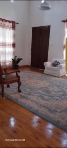 a living room with a couch and a table at White villa resort dodangoda in Kalutara