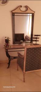 a dressing table with a mirror on top of it at White villa resort dodangoda in Kalutara