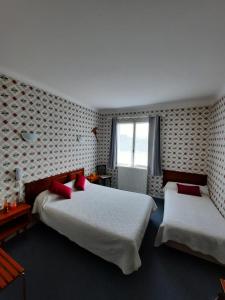 Postel nebo postele na pokoji v ubytování Auberge Béarn Bigorre