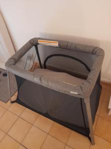 a small dog bed in a corner of a room at Atoumo piscine citerne in Le Gosier
