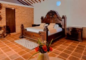 Кровать или кровати в номере Hotel Santa Barbara Colonial - Santa Fe de Antioquia +37 фотографий