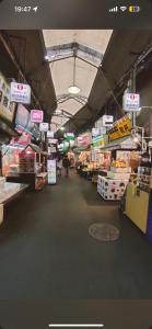 an aisle of a grocery store with signs on it at 難波心斎橋10minutes民宿2号室 in Osaka