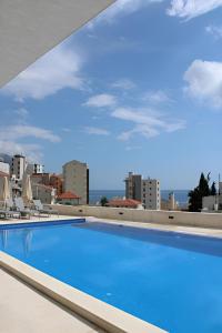 a swimming pool on the roof of a building at Elia Hotel Residence in Budva