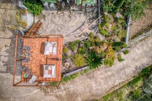 an overhead view of a building in a yard at Magical View Studios 1 Asproneri, Kamena Vourla in Kamena Vourla