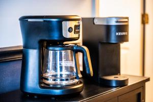 a blue coffee maker sitting on top of a counter at Stylin In The Smokies by Distinctive Getaways in Gatlinburg