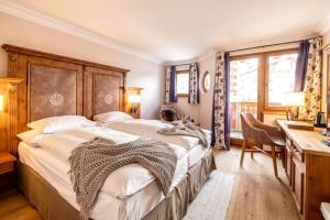 Ein Bett oder Betten in einem Zimmer der Unterkunft BelArosa Suiten & Wellness