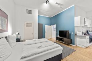 TV a/nebo společenská místnost v ubytování primeflats - Apartment Leberstr 58 Berlin Schöneberg